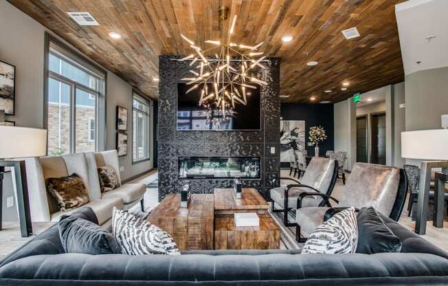 a living room with a couch and a table and a fireplace