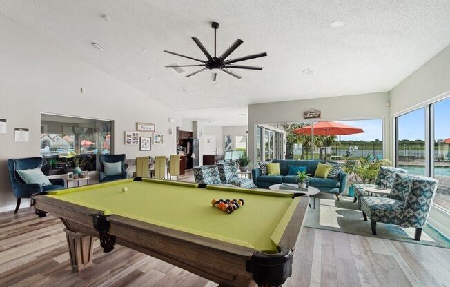 Clubhouse game room with pool table