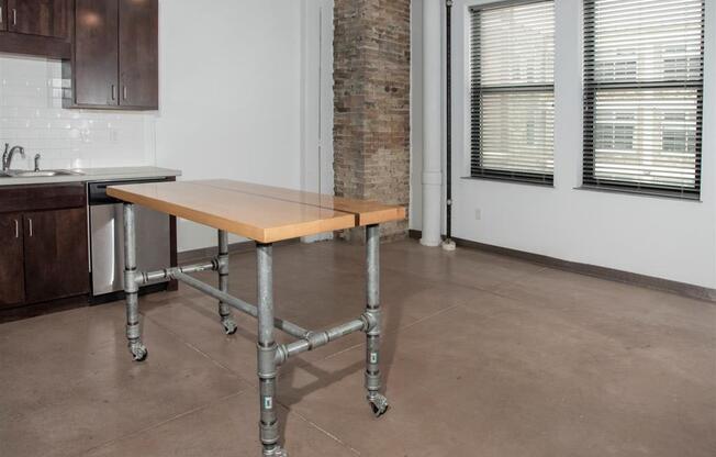 movable island and living room with exposed brick column