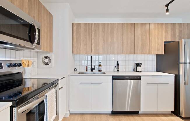 a kitchen with a sink and a refrigerator