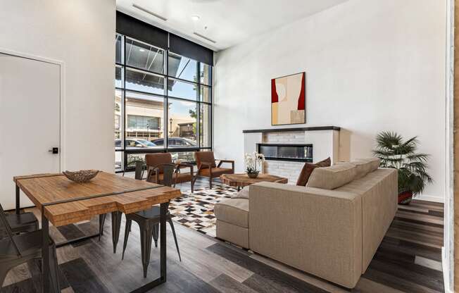 a living room with a couch and a table and a fireplace