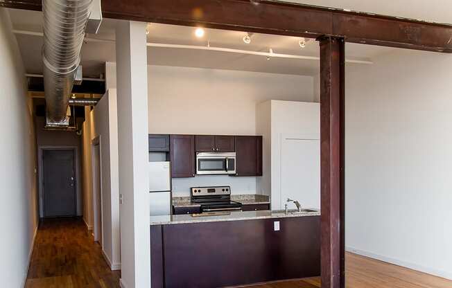 a view of the kitchen and living room from the dining room