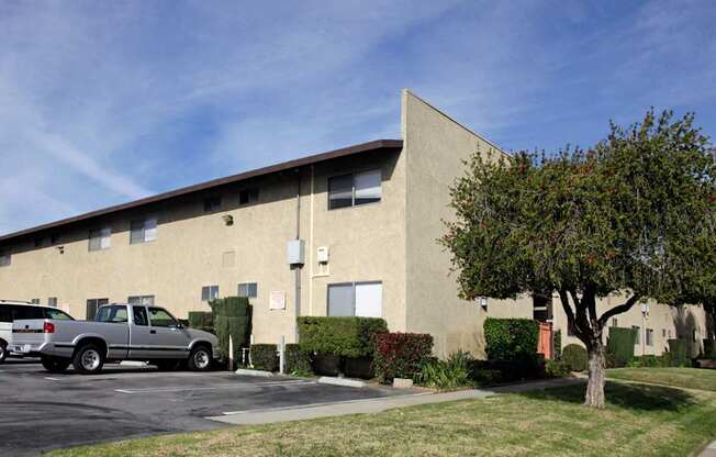 A building with a parking lot in front of it.