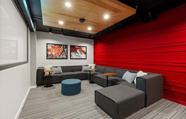 A modern lounge area with grey and blue seating.