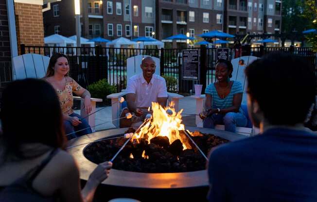 Group of Residents Seated Around Fireplace at The Aster Apartments, Cary, 27519