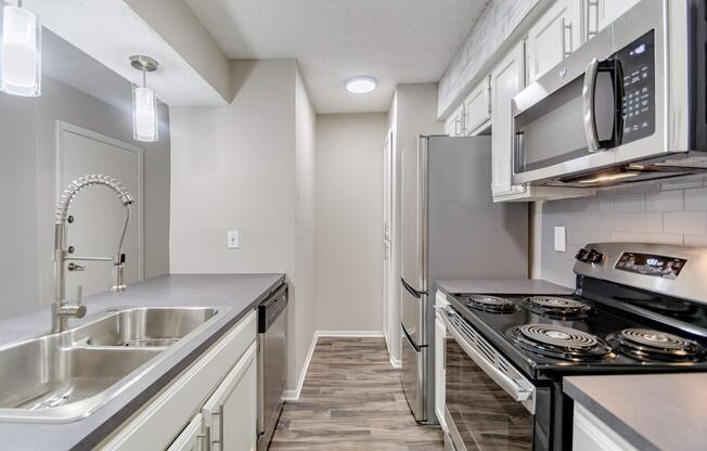 a large kitchen with stainless steel appliances