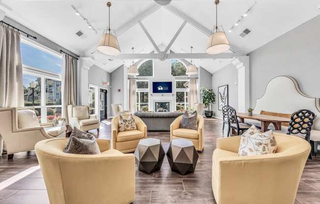 a living room with couches and chairs and a fireplace