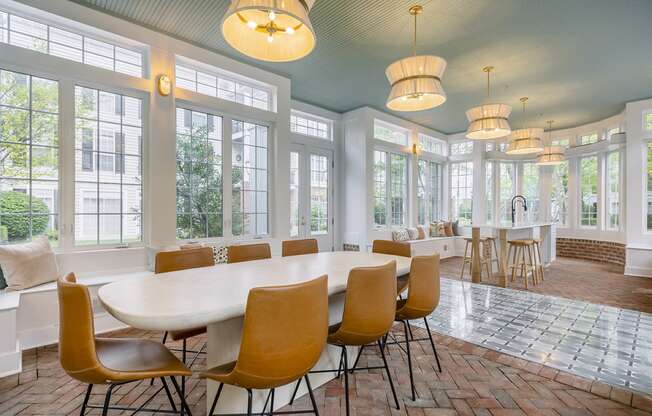 a conference room with large windows and a large table and chairs