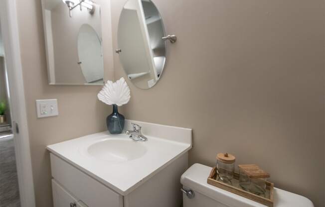 This is picture of the primary half bath in the 823 square foot 2 bedroom apartment at Aspen Village Apartments in the Westwood neighborhood of Cincinnati, OH.