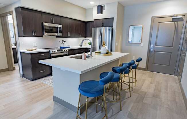 furnished kitchen with stool seating at Bayswater Apartments, Burlingame, CA