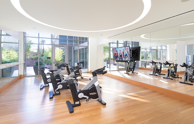 Expansive fitness center featuring a spin room