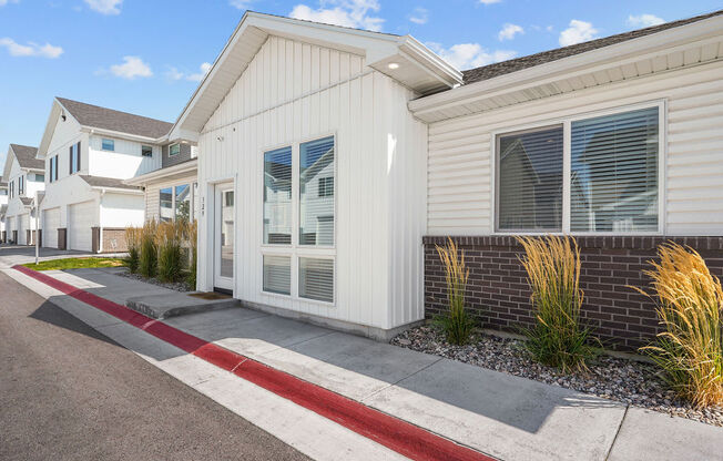 a building with a sidewalk in front of it