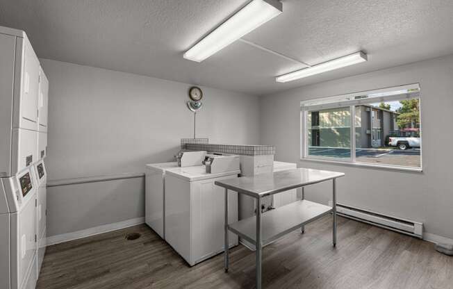 an empty kitchen with a sink and a window