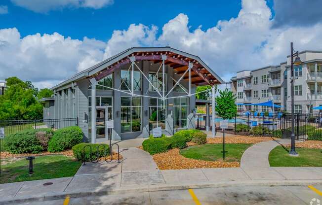 A building with a glass entrance and a red roof.