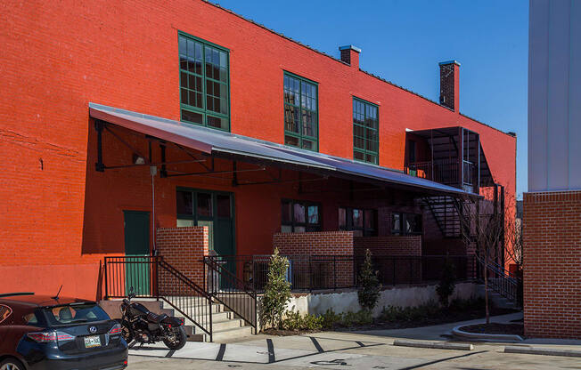 a red brick building with a blue awning in front of it