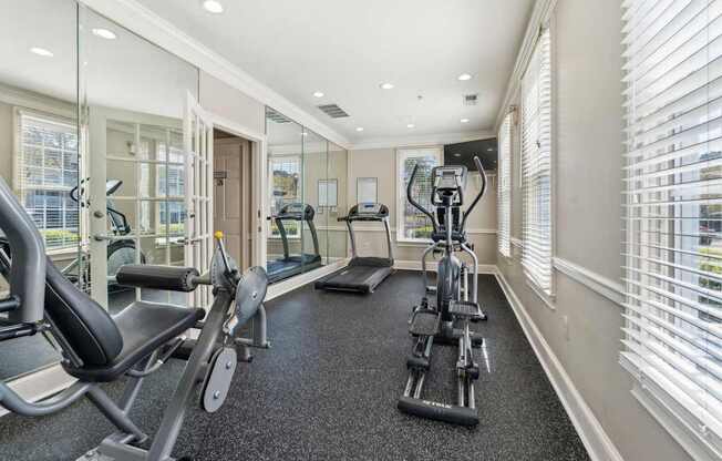 A spacious home gym with a variety of exercise equipment.