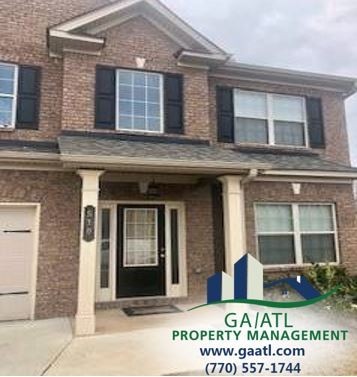 Large brick front 2-story house in Loganville