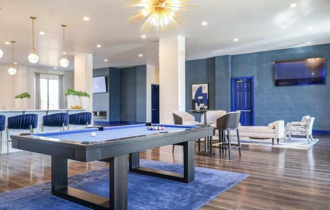 social lounge with billiards at Reveal on the Lake apartments