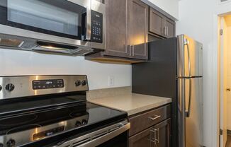 a kitchen with a stove microwave and refrigerator