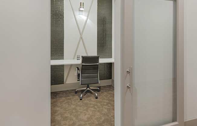 Work space in clubhouse with desk and sliding door