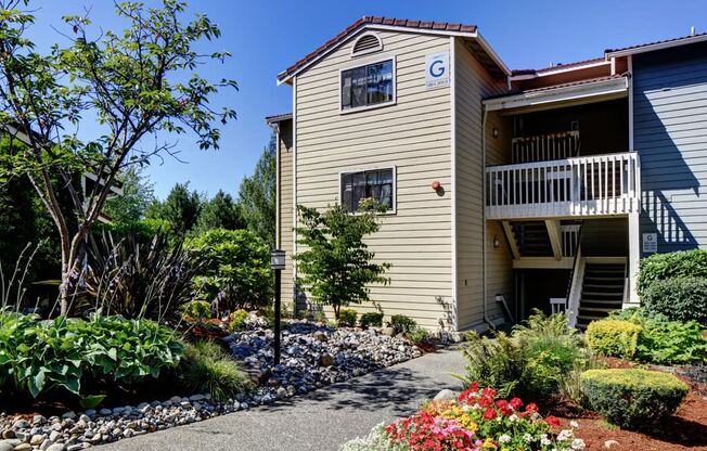 a house with a garden in front of it at 2000 Lake Washington Apartments, Renton, WA, 98056