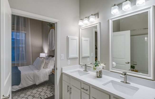 a bathroom with a large mirror and a sink