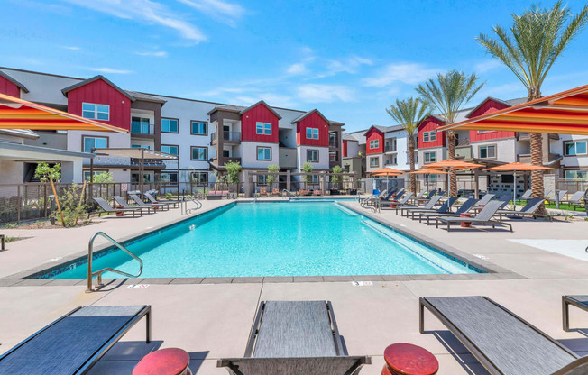 our apartments have a swimming pool with lounge chairs and umbrellasat Weylyn Luxury Apartments, Arizona