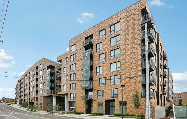 A large brick building with a balcony on the second floor.