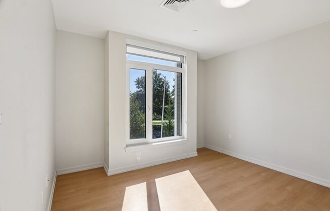 Bedroom with Large windows at Park77 Apartments, Cambridge, Massachusetts