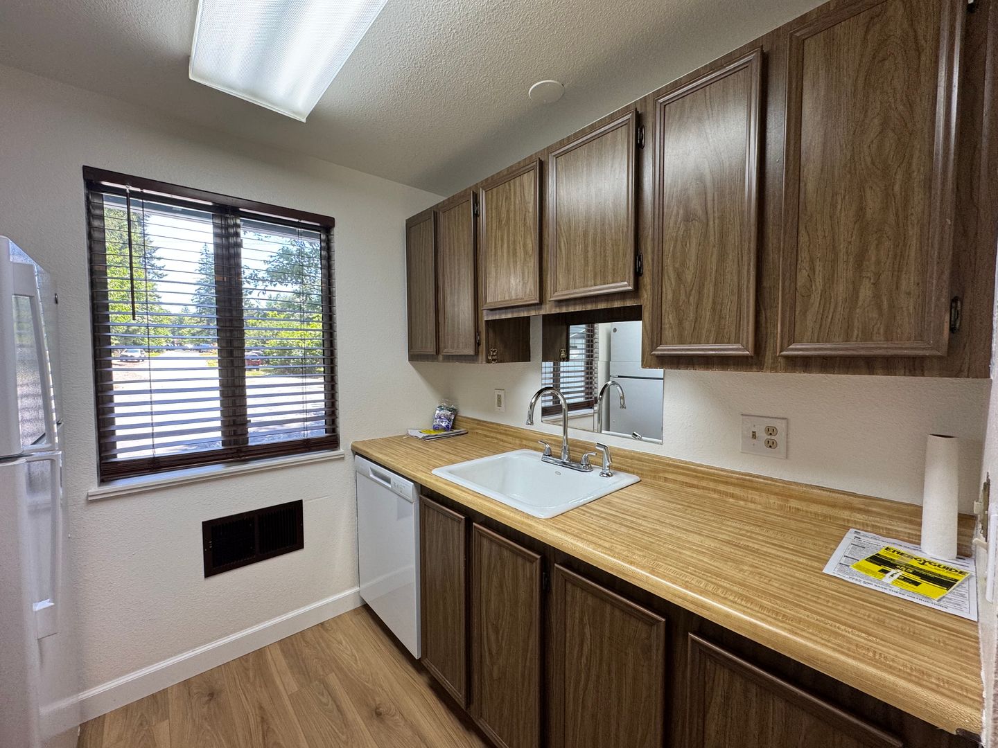 Charming Condo with Creek Views, Laminate Flooring, and Prime Location Near Washington Square!