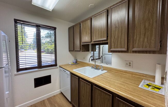 Charming Condo with Creek Views, Laminate Flooring, and Prime Location Near Washington Square!