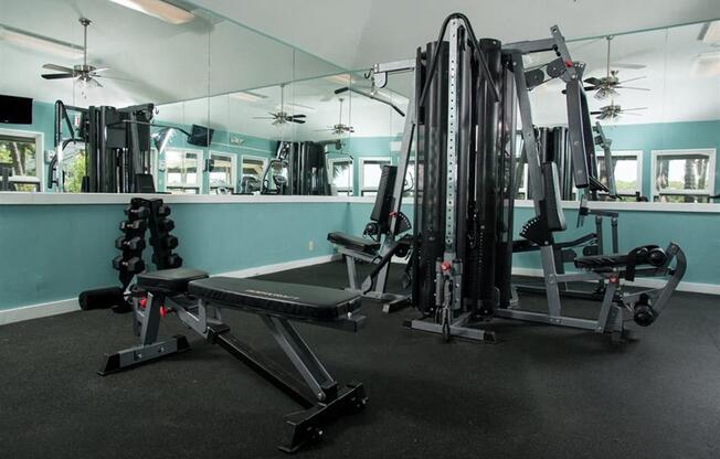 Gym with weights and mirrors at West Wind Landing, Savannah, GA, 31410