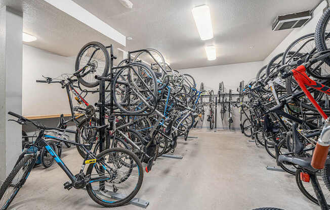 A bike parking room with many bikes.