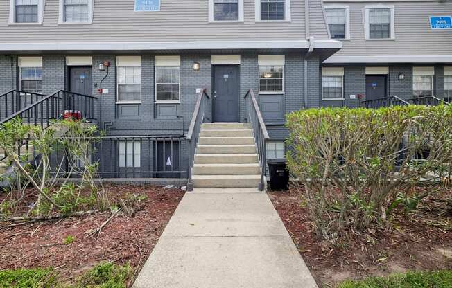 A building with a blue sign on the front door.