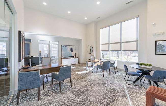 a living room with a large window and a table and chairs at Sycamore at Tyvola, Charlotte, NC, 28217