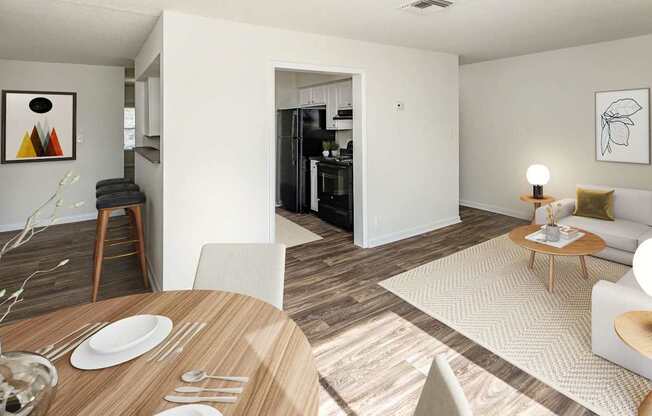 A modern dining room with a wooden table set for two.