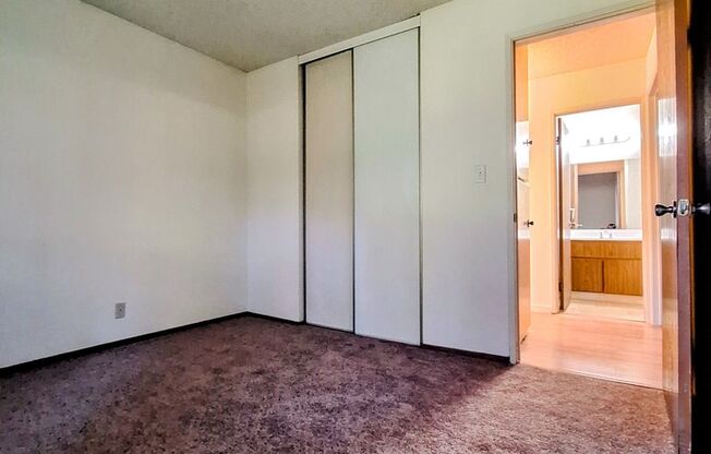 Spacious 2bd First Floor Condo W/Private Patio, Attached Garage, & Private Laundry Room