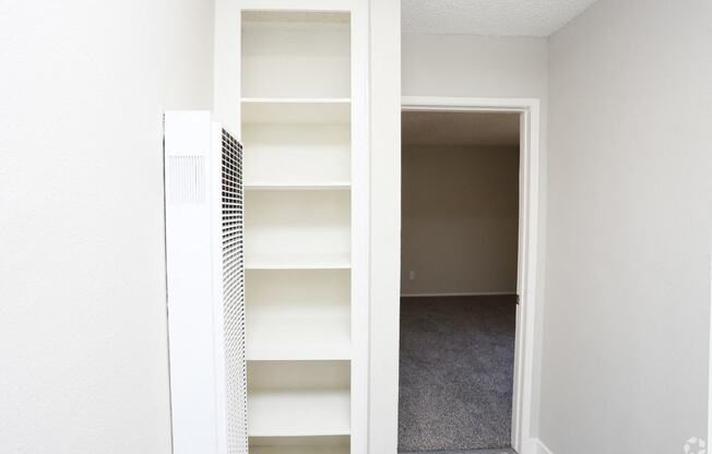 View of hallway linen storage closet.