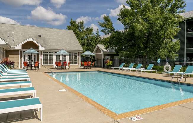 Apartments in Elk River MN_outdoor pool with patio furniture