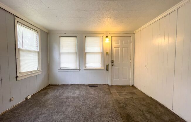 Fall into this cozy 3-Bedroom Home with a fenced in yard & detached garage!