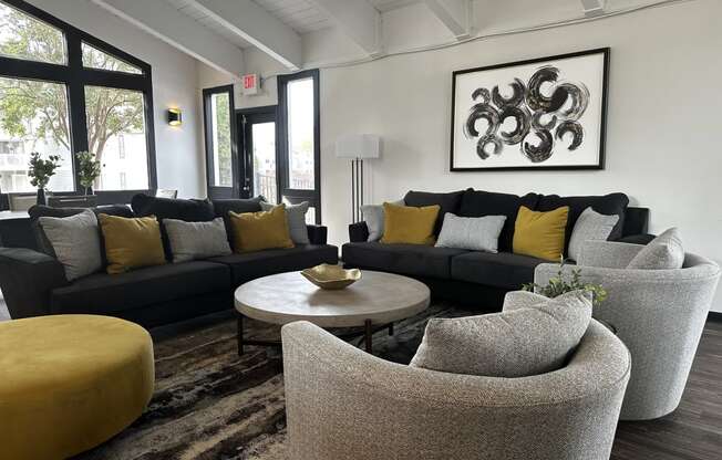 a living room with couches and chairs and a coffee table