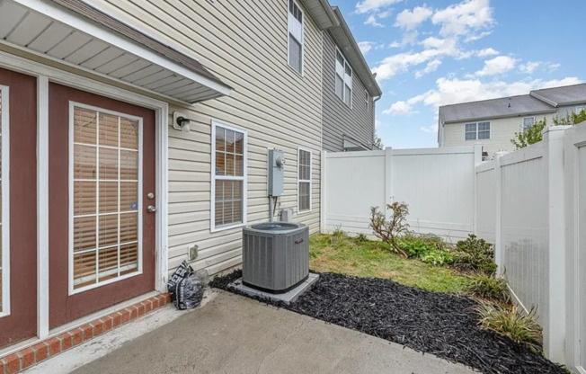 Immaculate beautiful 3-bedroom, 2.5-bath townhouse in Greensboro with 1 car garage/fenced in patio