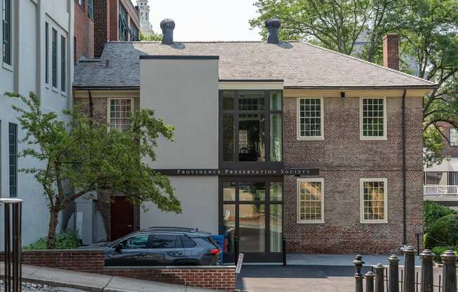 A building with a sign that says providence preservation society