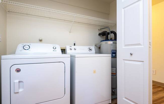 the laundry room is equipped with washer and dryers