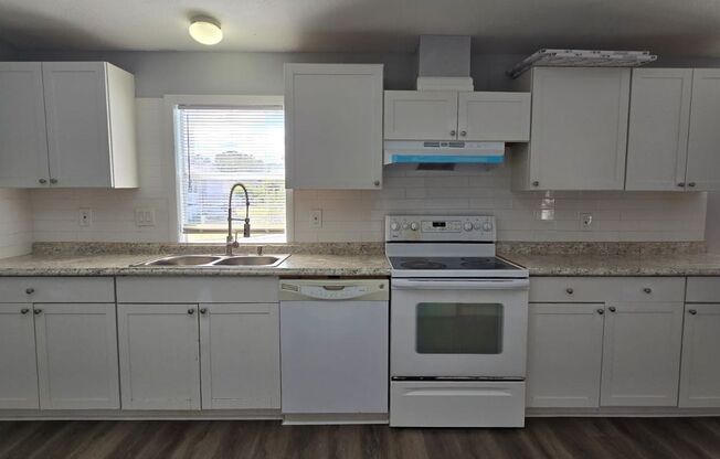 Newly renovated 4/3 property with fenced in yard!