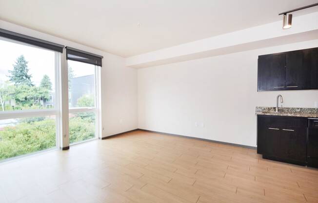 an empty living room with a sliding glass door