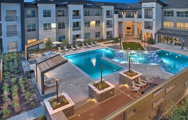 an aerial view of an apartment complex with a pool at Hunters Creek Apartments, Denton, TX 76210