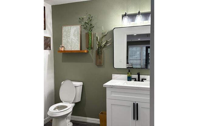 a kitchen with a sink and a mirror