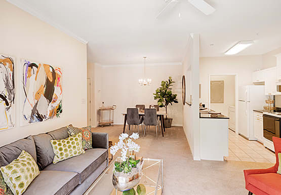 Living room with couch and chair; separate dining room; galley kitchen