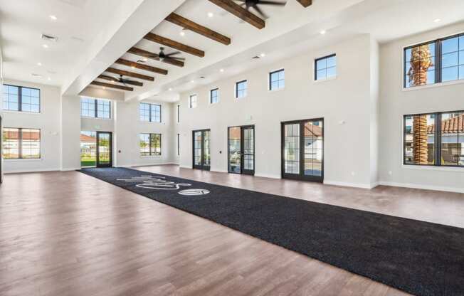 living room with hardwood flooring and large windows at Stella, San Tan Valley, AZ 85143